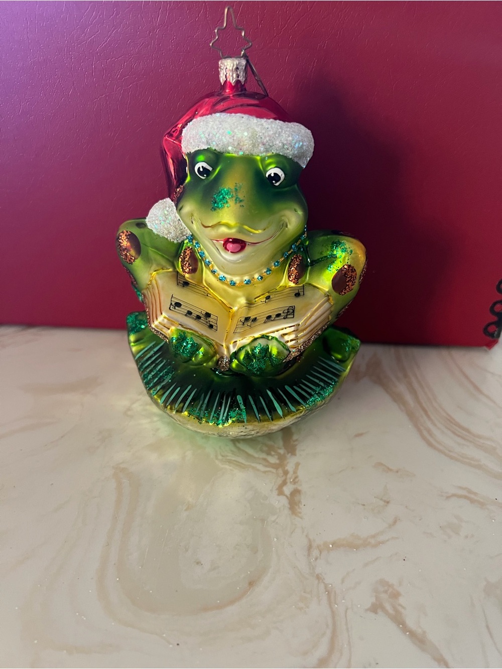 Christopher Radko Green Frog Caroler Ornament with Red Santa Hat
